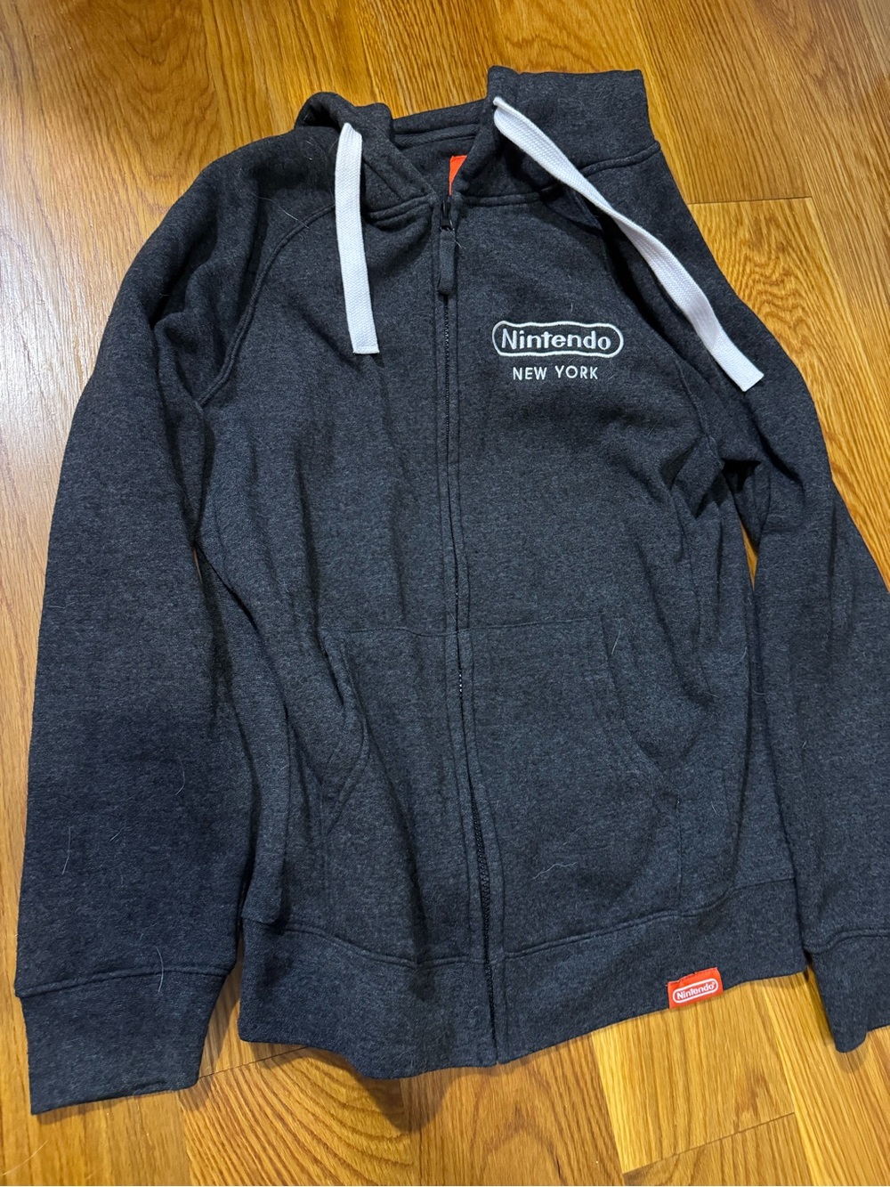 Nintendo New York - Dark Gray Sweatshirt Hoodie with Red Logo Tab - NEVER WORN